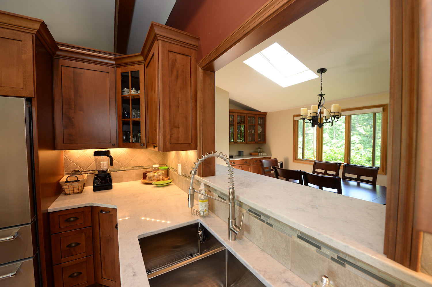 Custom Wood Cabinets with White Marble Countertops
