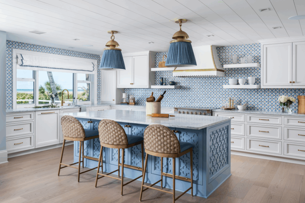 Bright kitchen featuring a light blue island with woven barstools, blue patterned tile backsplash, and shiplap ceiling in Columbus, Ohio.